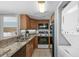 Galley kitchen includes a washer-dryer combo and an opening through to the bedroom at 2701 N Ocean Blvd. # 1154-60, Myrtle Beach, SC 29577