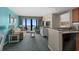 Relax in the living room with an ocean view, balcony access, and a peek into the cozy bedroom at 2701 N Ocean Blvd. # 1154-60, Myrtle Beach, SC 29577