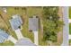 An aerial view showcasing the property's roof, backyard, and proximity to neighboring homes and landscaping at 3004 Fiddler Ct., Loris, SC 29569