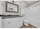 Full bathroom with a tub and shower combo, granite countertops, and a framed mirror at 3004 Fiddler Ct., Loris, SC 29569