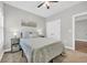 Bedroom with ceiling fan, carpeted floors, and access to a closet and doorway at 3004 Fiddler Ct., Loris, SC 29569