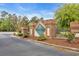 Elegant brick entrance to Woodland Valley with manicured landscaping offering a welcoming sense of arrival at 3004 Fiddler Ct., Loris, SC 29569