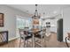Open dining area with a view of the modern kitchen and outdoor access at 3004 Fiddler Ct., Loris, SC 29569