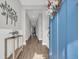Bright entryway with wood-look floors and soft gray walls, complemented by light-colored trim at 3004 Fiddler Ct., Loris, SC 29569
