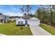 Charming one-story home with manicured lawn, white siding, and blue shutters at 3004 Fiddler Ct., Loris, SC 29569