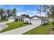 One-story home with manicured lawn, white siding, and blue shutters at 3004 Fiddler Ct., Loris, SC 29569