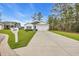 Charming one-story home with manicured lawn, white siding, and blue shutters at 3004 Fiddler Ct., Loris, SC 29569