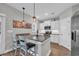 Kitchen with a breakfast bar, modern appliances, and white cabinets at 3004 Fiddler Ct., Loris, SC 29569