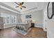 Serene main bedroom with tray ceiling, plantation shutters, and stylish decor at 3004 Fiddler Ct., Loris, SC 29569