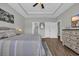 Spacious main bedroom featuring a tray ceiling, wood-look floors and access to the main bathroom at 3004 Fiddler Ct., Loris, SC 29569