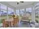 Sunroom with a table, chairs, a loveseat, and a view of the backyard at 3004 Fiddler Ct., Loris, SC 29569