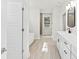 Modern bathroom with double vanity, soaking tub, tiled floors, and natural light at 348 Autumn Pheasant Loop, Calabash, NC 28467