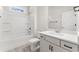 Well-lit bathroom with shower-tub combo, white cabinets, and modern fixtures at 348 Autumn Pheasant Loop, Calabash, NC 28467
