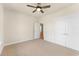 Bedroom with plush carpeting, ceiling fan, and large closet space at 348 Autumn Pheasant Loop, Calabash, NC 28467