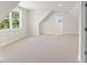 Spacious bonus room with neutral carpet, dormer windows, and versatile layout at 348 Autumn Pheasant Loop, Calabash, NC 28467