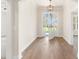 Bright foyer with hardwood floors, open door with a view to the front yard at 348 Autumn Pheasant Loop, Calabash, NC 28467