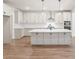 Bright kitchen featuring a large island, stainless steel appliances, and modern cabinetry at 348 Autumn Pheasant Loop, Calabash, NC 28467