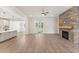 Open-concept living room featuring a stone fireplace and french doors to the outside at 348 Autumn Pheasant Loop, Calabash, NC 28467