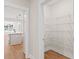 Walk-in pantry with ample white wire shelving adjacent to the kitchen at 348 Autumn Pheasant Loop, Calabash, NC 28467