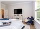 Bedroom boasts light floors, TV, furniture, and window to allow ample sunlight at 402 Bumble Circle, Murrells Inlet, SC 29576