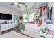 Spacious bedroom boasts hardwood floors, a ceiling fan, and a large dresser for ample storage space at 402 Bumble Circle, Murrells Inlet, SC 29576