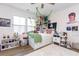 Unique bedroom featuring hardwood floors, a ceiling fan, and an oversized bed frame with plenty of storage at 402 Bumble Circle, Murrells Inlet, SC 29576
