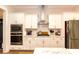 Well-lit kitchen with stainless steel appliances and ample counter space at 402 Bumble Circle, Murrells Inlet, SC 29576