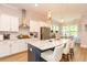 Modern kitchen with white cabinets, stainless steel appliances, and a large island at 402 Bumble Circle, Murrells Inlet, SC 29576