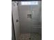 Tiled shower with pebble flooring and glass door at 4831 Riverside Dr., North Myrtle Beach, SC 29582