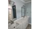 Bathroom with double sinks, quartz countertop, and modern fixtures at 4831 Riverside Dr., North Myrtle Beach, SC 29582