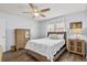 Cozy bedroom with natural lighting, ceiling fan, hardwood floors, and comfortable furnishings at 5508 Porcher Dr. # 3, Myrtle Beach, SC 29577