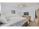 Bright bedroom featuring a ceiling fan, comfy queen bed, and stylish beach decor at 5508 Porcher Dr. # 3, Myrtle Beach, SC 29577