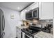 Kitchen featuring stainless appliances, a range, and granite countertops at 5508 Porcher Dr. # 3, Myrtle Beach, SC 29577