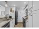 Updated kitchen with granite countertops, stainless appliances, and white cabinetry at 5508 Porcher Dr. # 3, Myrtle Beach, SC 29577