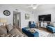 Open living area with stylish seating, television, and view into kitchen at 5508 Porcher Dr. # 3, Myrtle Beach, SC 29577
