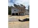 New home construction with a covered porch under construction on a lot with protective silt fencing at 8743 Baton Rouge Ave Nw, Calabash, NC 28467