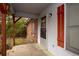 A rear side view of a home with red trim and a covered porch at 1001 Creel St., Conway, SC 29527