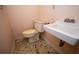 A bathroom featuring a toilet and sink, highlighting the fixtures and layout of the space at 1001 Creel St., Conway, SC 29527