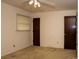 Bedroom showcasing neutral walls, a ceiling fan, a window, and closet doors, emphasizing the room's design elements at 1001 Creel St., Conway, SC 29527