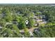 Aerial view of gray mobile home nestled among lush trees and a friendly community at 103 Off Shore Dr., Murrells Inlet, SC 29576