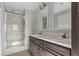 Spacious bathroom featuring double sinks, marble countertop, and shower at 103 Off Shore Dr., Murrells Inlet, SC 29576
