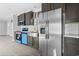 Kitchen boasts stainless steel appliances, modern cabinets, and stylish white backsplash at 103 Off Shore Dr., Murrells Inlet, SC 29576