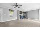 Bright, open floor plan features new gray vinyl flooring and a modern ceiling fan at 103 Off Shore Dr., Murrells Inlet, SC 29576