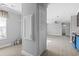 Hallway with closet leading to open living room and kitchen at 103 Off Shore Dr., Murrells Inlet, SC 29576
