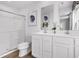 Bathroom featuring double sinks, modern fixtures, and a glass-enclosed shower for a sleek design at 1037 Oak Meadow Dr., Conway, SC 29526