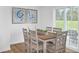 Bright dining area with a wooden table, seating for six, and sliding glass doors to the outdoors at 1037 Oak Meadow Dr., Conway, SC 29526