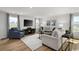 Spacious living room with hardwood floors, comfortable seating, a large TV, and stylish decor at 1037 Oak Meadow Dr., Conway, SC 29526