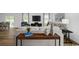 Inviting living room featuring modern decor, wood flooring, a comfortable sofa, and ample natural light at 1037 Oak Meadow Dr., Conway, SC 29526