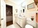 Bathroom with tiled floor and walls, and a door leading to another room at 106 Jessamine St., Andrews, SC 29510