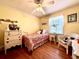Charming bedroom with wooden floors, a bed, and natural light at 106 Jessamine St., Andrews, SC 29510